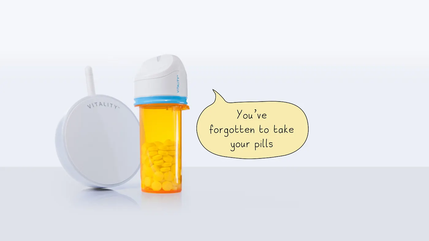 A GlowCap attached to a prescription bottle, reminding its owner to take a pill.