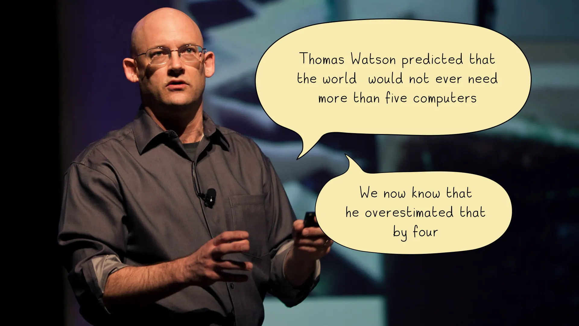 Clay Shirky on stage with his observation that Thomas Watson overestimated the world's need for computers by four.